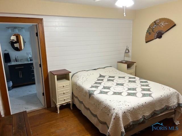 163 E Hull St, Edgerton, OH 43517 - bedroom with a sink and wood finished floors