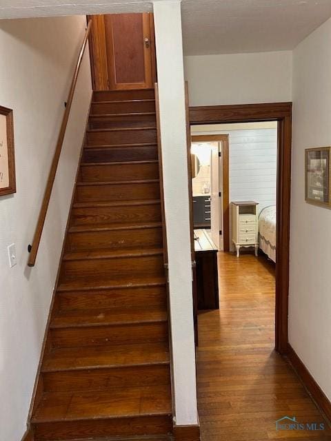163 E Hull St, Edgerton, OH 43517 - staircase with wood finished floors and baseboards