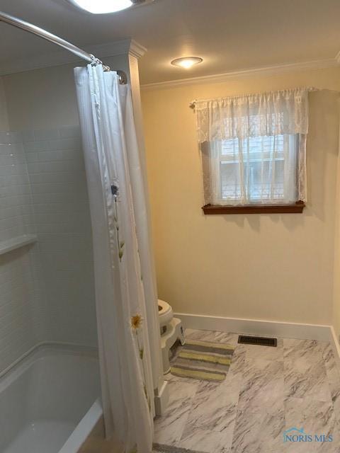 163 E Hull St, Edgerton, OH 43517 - bathroom with ornamental molding, toilet, baseboards, and visible vents