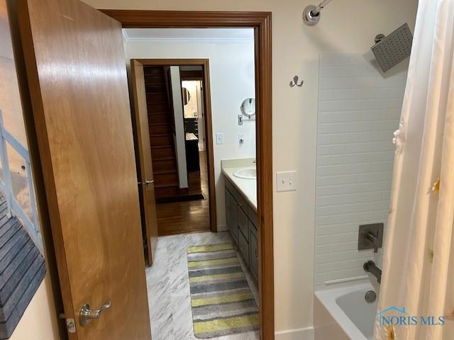 163 E Hull St, Edgerton, OH 43517 - bathroom with vanity and shower / bathtub combination with curtain
