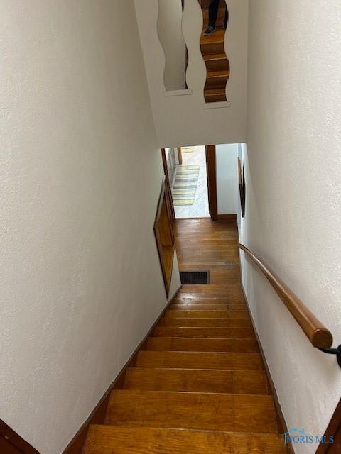 163 E Hull St, Edgerton, OH 43517 - staircase with hardwood / wood-style flooring and visible vents