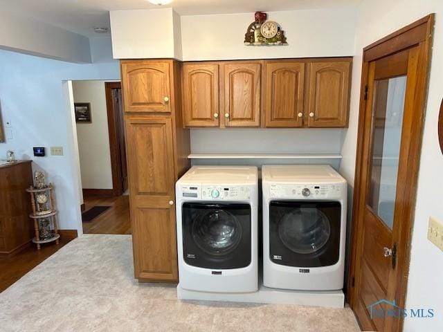 163 E Hull St, Edgerton, OH 43517 - washroom featuring cabinet space, independent washer and dryer, and wood finished floors
