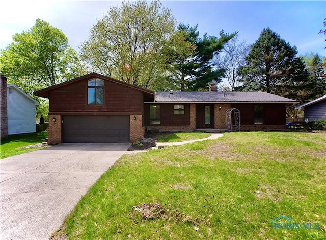 416 Donbar Dr, Bowling Green, OH 43402 - view of front of property featuring driveway, a chimney, brick siding, a front lawn, and an attached garage