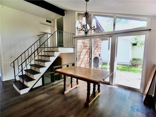 416 Donbar Dr, Bowling Green, OH 43402 - unfurnished dining area featuring an inviting chandelier, vaulted ceiling with beams, wood finished floors, and stairway