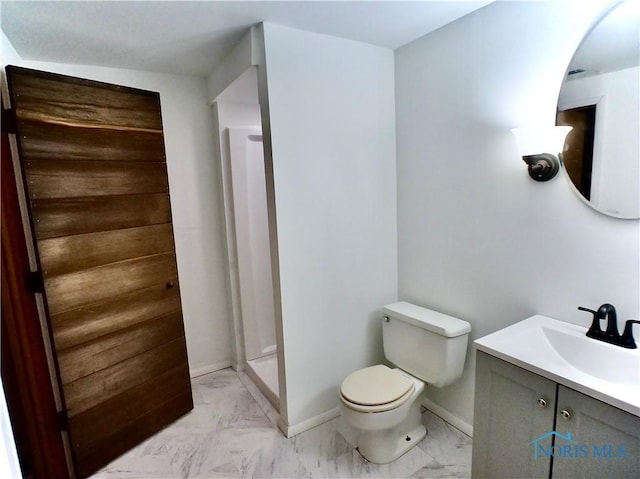 416 Donbar Dr, Bowling Green, OH 43402 - full bath with vanity, toilet, marble finish floor, baseboards, and a shower stall