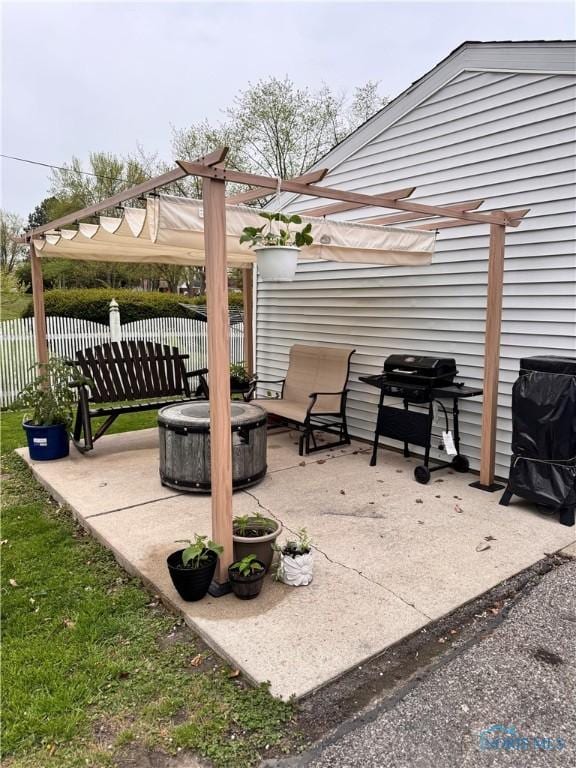 view of patio / terrace featuring fence and grilling area