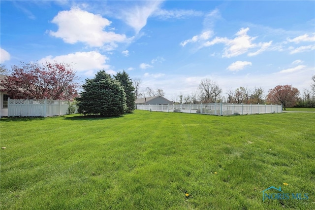 view of yard with fence