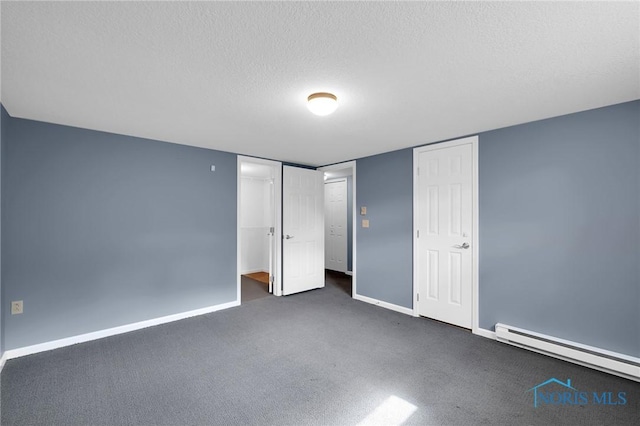 unfurnished bedroom with baseboards, carpet flooring, a textured ceiling, and a baseboard heating unit