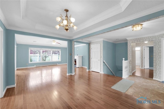 interior space featuring crown molding, hardwood / wood-style flooring, and a baseboard radiator