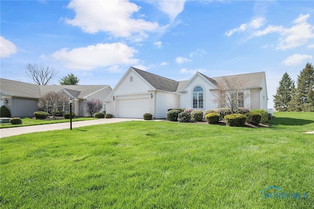 ranch-style home featuring a garage, a front lawn, and driveway