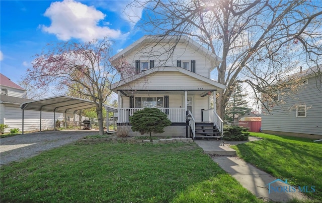 view of front of house with a carport, a front lawn, driveway, and covered porch