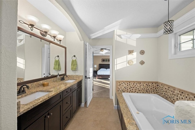 full bath with a garden tub, tile patterned flooring, double vanity, connected bathroom, and a sink
