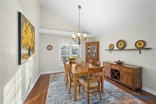dining space with baseboards, a chandelier, dark wood finished floors, and high vaulted ceiling
