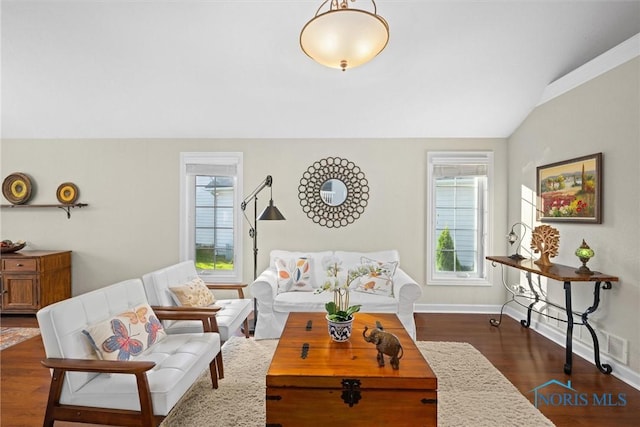 living room with baseboards, vaulted ceiling, and dark wood-style floors