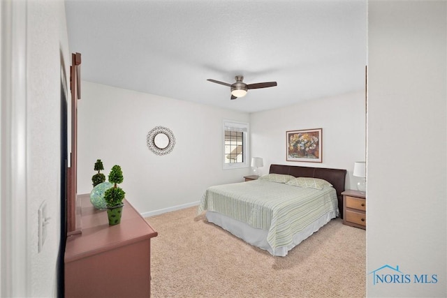 bedroom with baseboards, ceiling fan, and carpet