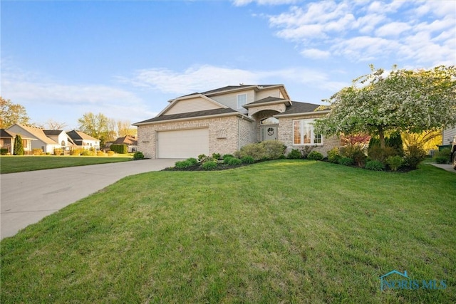 traditional-style house with brick siding, an attached garage, driveway, and a front yard