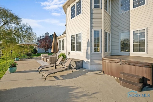 view of patio / terrace featuring a hot tub