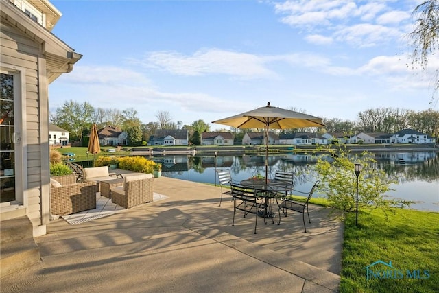 view of patio featuring a residential view, a water view, and outdoor lounge area