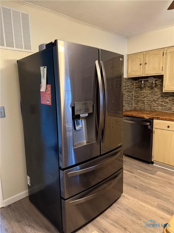444 Rector Ave, Findlay, OH 45840 - kitchen featuring stainless steel fridge, dishwasher, light wood-style flooring, backsplash, and light brown cabinets