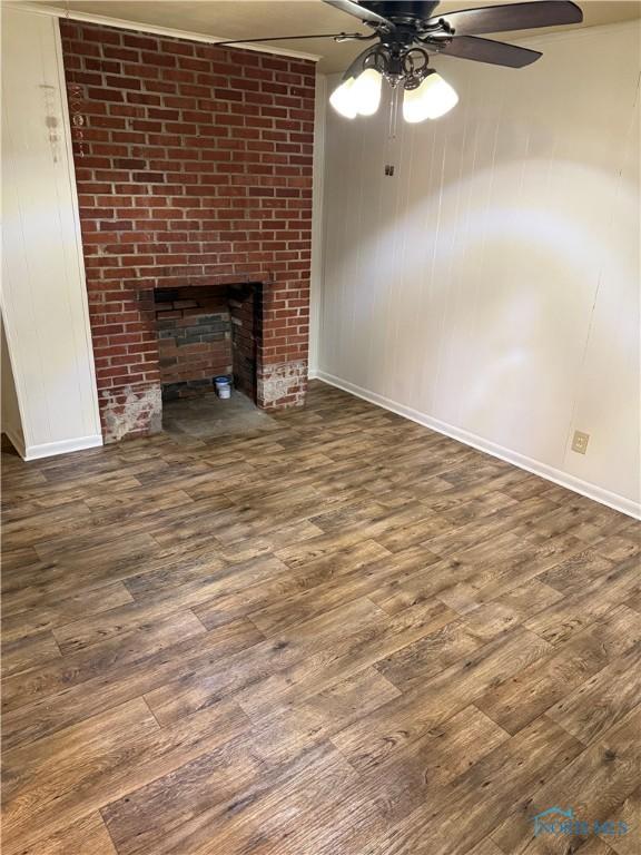 444 Rector Ave, Findlay, OH 45840 - unfurnished living room with ceiling fan, baseboards, and wood finished floors