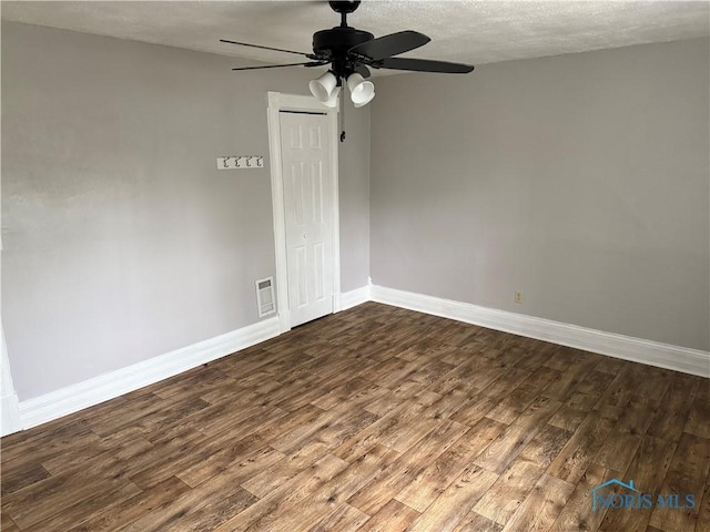 444 Rector Ave, Findlay, OH 45840 - empty room featuring dark wood-style flooring, ceiling fan, and baseboards