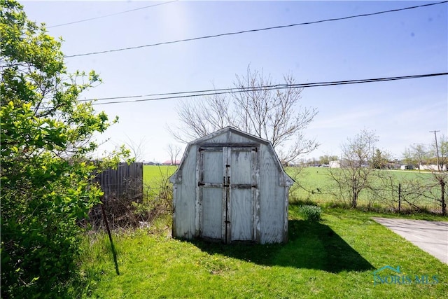 view of shed with fence