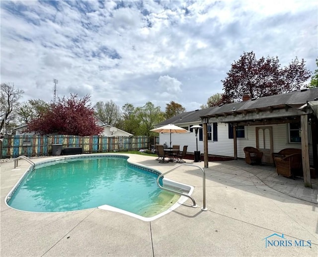 view of swimming pool featuring a fenced backyard, a fenced in pool, and a patio