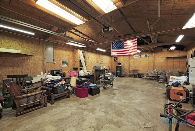 miscellaneous room with concrete floors and a workshop area