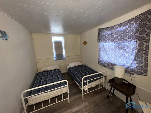bedroom featuring wood finished floors