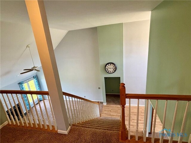 3518 Butz Rd, Maumee, OH 43537 - stairs featuring vaulted ceiling, carpet floors, a ceiling fan, and baseboards