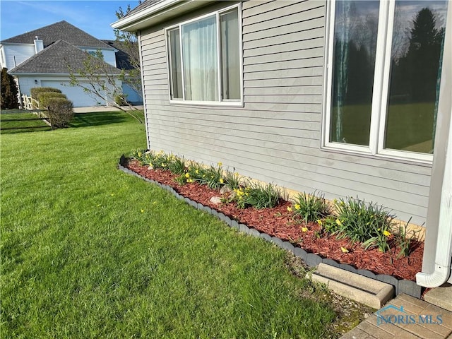 view of property exterior featuring a yard