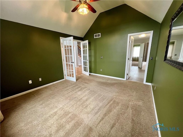 3518 Butz Rd, Maumee, OH 43537 - carpeted empty room featuring ceiling fan, french doors, vaulted ceiling, and baseboards