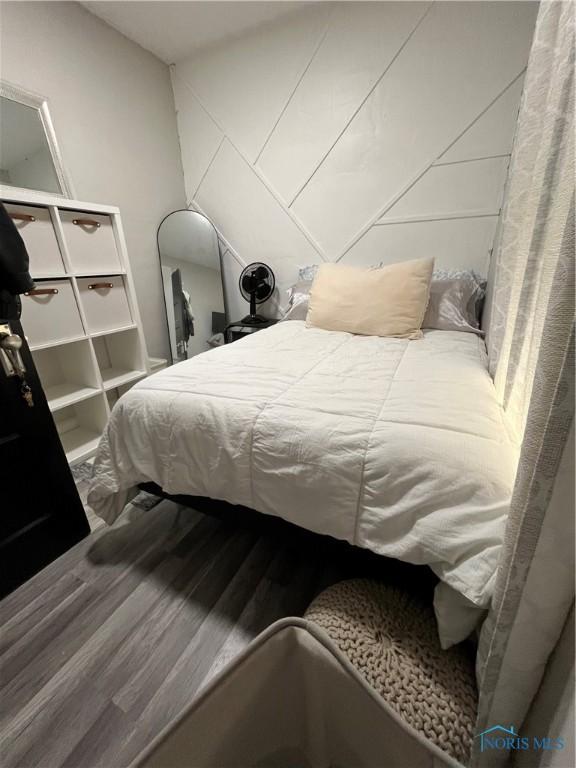 bedroom featuring wood finished floors