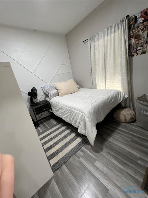 bedroom featuring wood finished floors