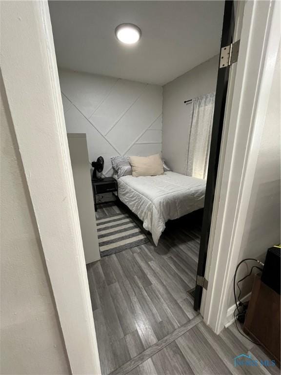 bedroom with wood finished floors