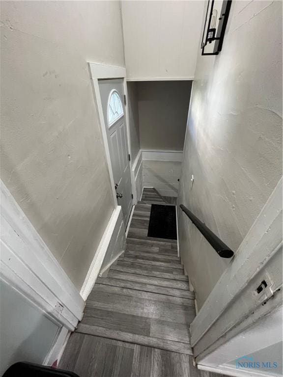 stairs with wood finished floors