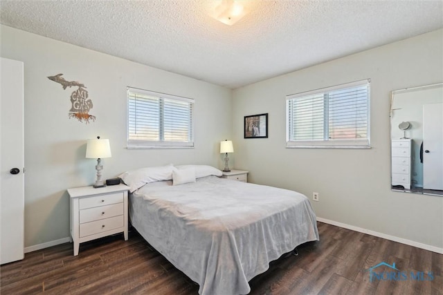 2123 Keen Ave, Toledo, OH 43611 - bedroom featuring baseboards, a textured ceiling, and dark wood-type flooring
