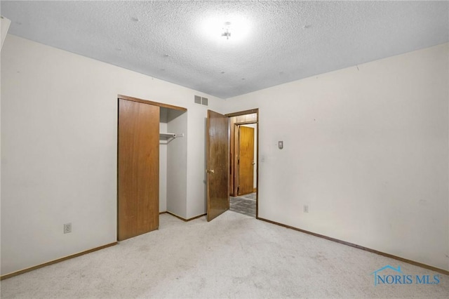 13921 Defiance Pike, Rudolph, OH 43462 - unfurnished bedroom featuring carpet, a closet, a textured ceiling, and baseboards