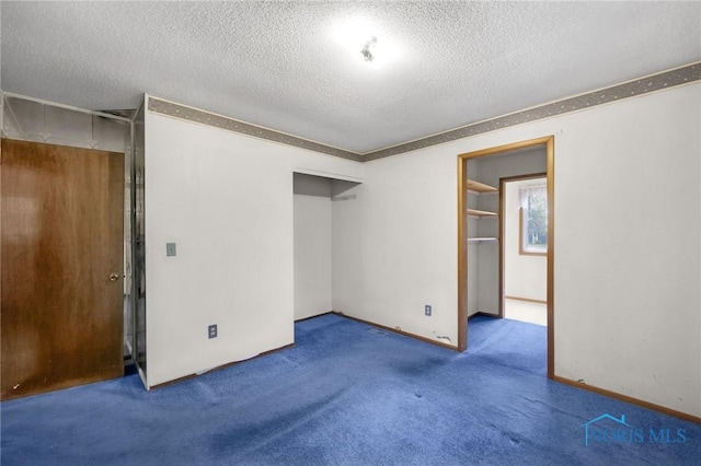 13921 Defiance Pike, Rudolph, OH 43462 - unfurnished bedroom featuring a textured ceiling, carpet, a closet, and baseboards