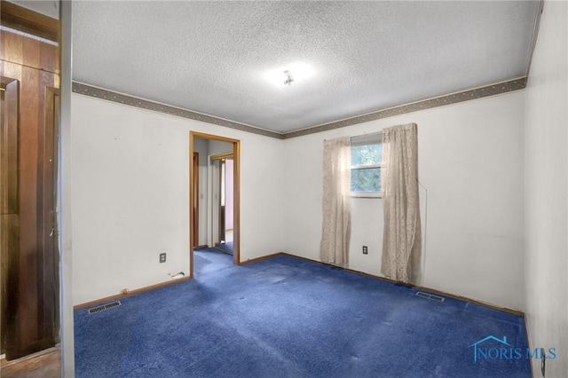 13921 Defiance Pike, Rudolph, OH 43462 - spare room with a textured ceiling, crown molding, baseboards, and carpet