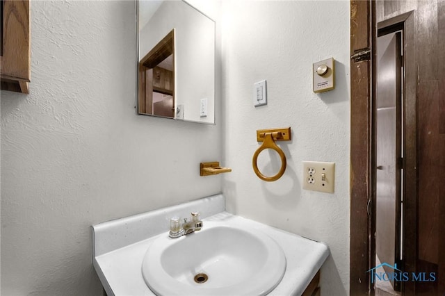 13921 Defiance Pike, Rudolph, OH 43462 - bathroom featuring vanity and a textured wall