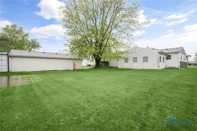 13921 Defiance Pike, Rudolph, OH 43462 - view of grassy yard with central AC