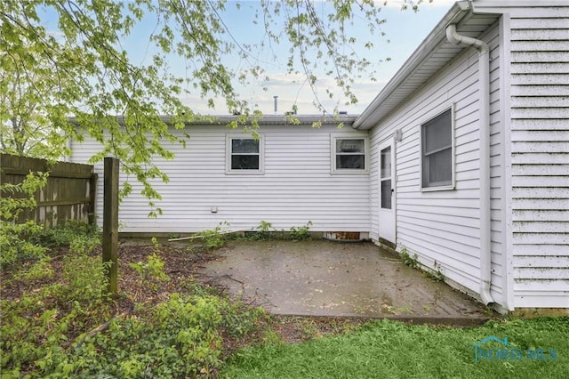 13921 Defiance Pike, Rudolph, OH 43462 - view of home's exterior with a patio area and fence