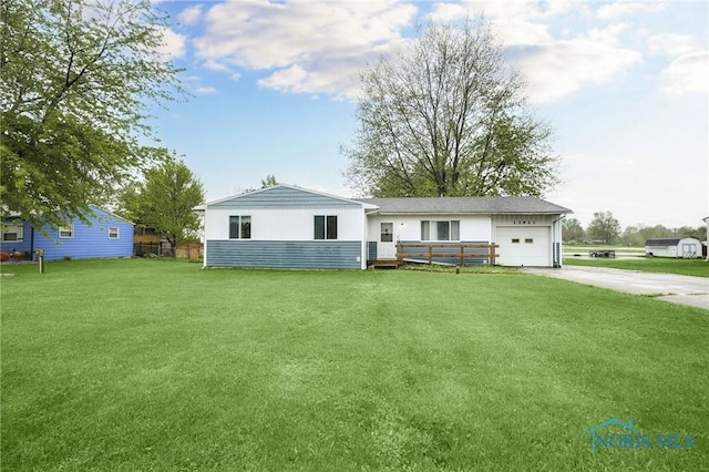 13921 Defiance Pike, Rudolph, OH 43462 - ranch-style house with concrete driveway, an attached garage, and a front yard