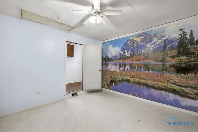 13921 Defiance Pike, Rudolph, OH 43462 - empty room featuring a water view, tile patterned floors, a ceiling fan, and baseboards