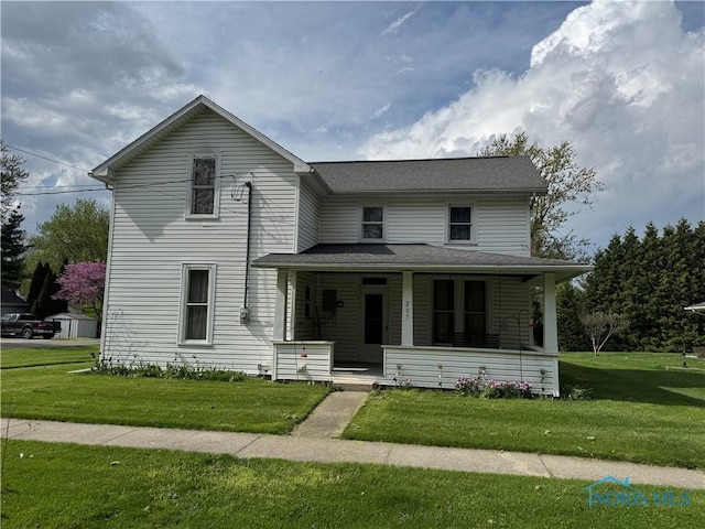 view of front of property with a front lawn and covered porch