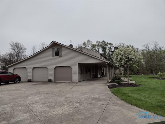 view of home's exterior featuring a lawn and driveway
