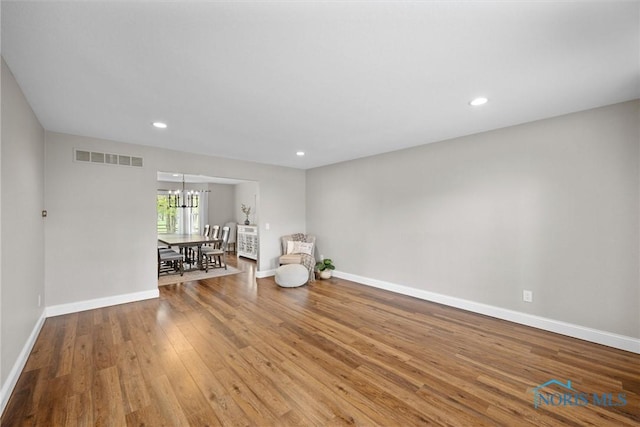 1135 Pimlico Park, Holland, OH 43528 - unfurnished room with visible vents, wood finished floors, baseboards, a chandelier, and recessed lighting