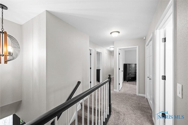 1135 Pimlico Park, Holland, OH 43528 - hall featuring baseboards, carpet flooring, and an upstairs landing