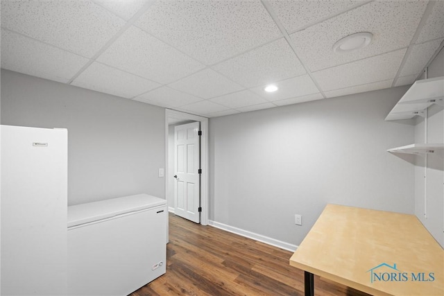 1135 Pimlico Park, Holland, OH 43528 - unfurnished office with a paneled ceiling, baseboards, and wood finished floors